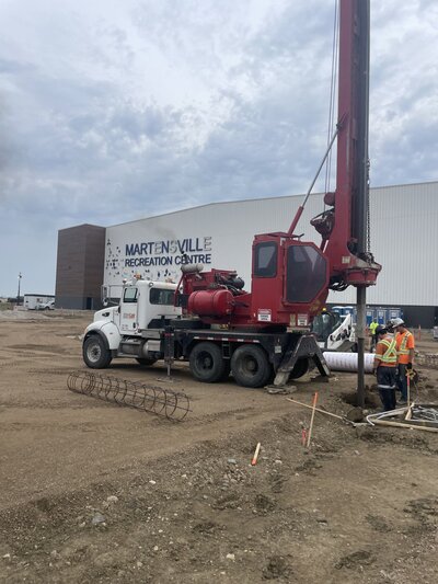 installation of helical piles for a rink