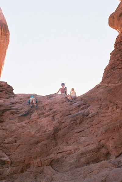 Big Bend photographer documents a heartfelt family moment in the desert mountains of West Texas, using a tripod to capture golden light, cacti, and rugged peaks in the backdrop.