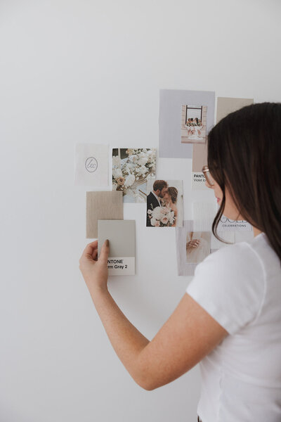 Danielle doing a brand moodboard on the wall