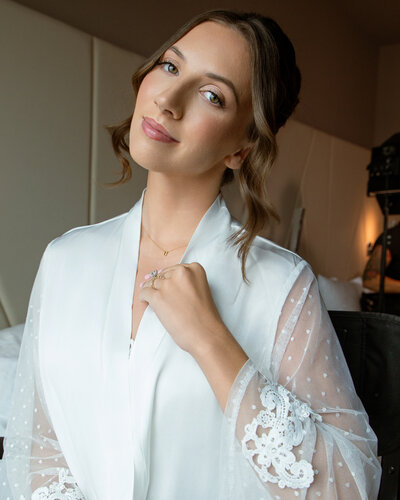 Hair and Makeup Orlando Florida | Luxury Bridal Hair and Makeup Services in Central Florida Beauty Brigade | Bride in a curled updo with her bridesmaids in robes