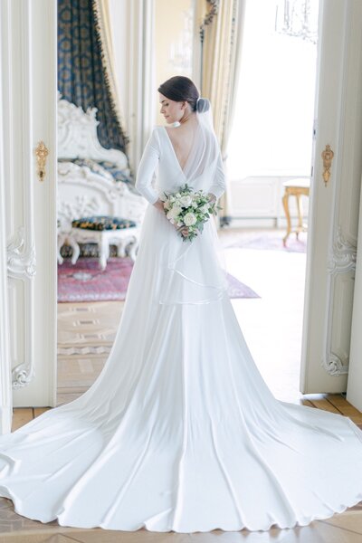Luxury bride with her bridal bouquet at Hotel Imperial Royal Suite 