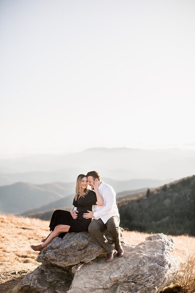 couple sitting on a boulder by Knoxville Wedding Photographer, Amanda May Photos
