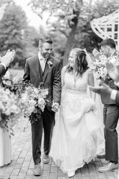 Bride and groom walk up memorial steps at their DC wedding