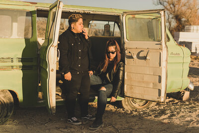 LGBTQ+ couple poses in las vegas desert for engagement photos