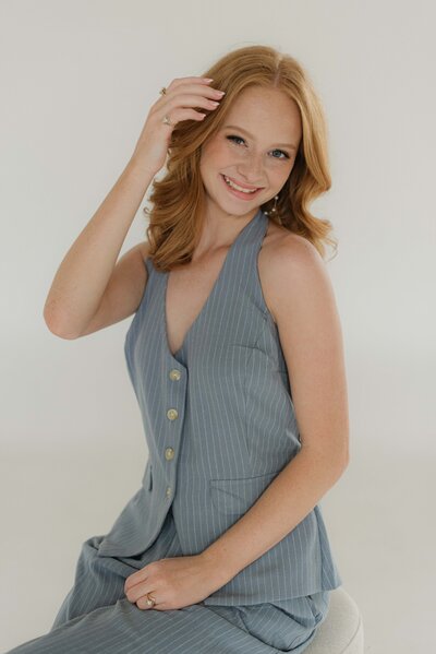 Knoxville Engagement couple shows off their ring by posing in Downtown Knoxville. 