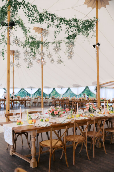 Tented wedding in Eagles Mere Pennsylvania filled with soft pinks and oranges.