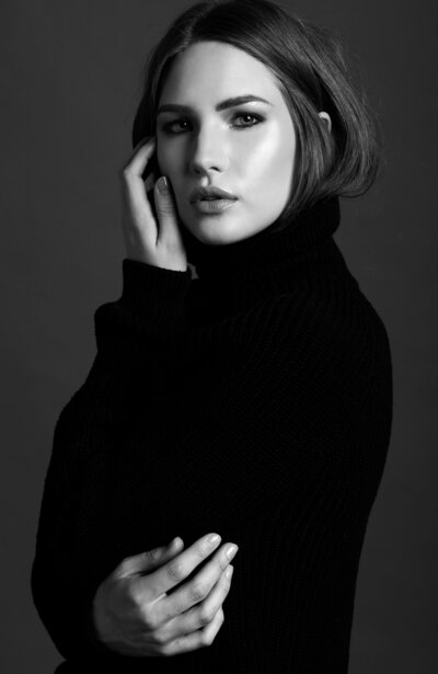 Black and white portrait of a woman looking at the camera