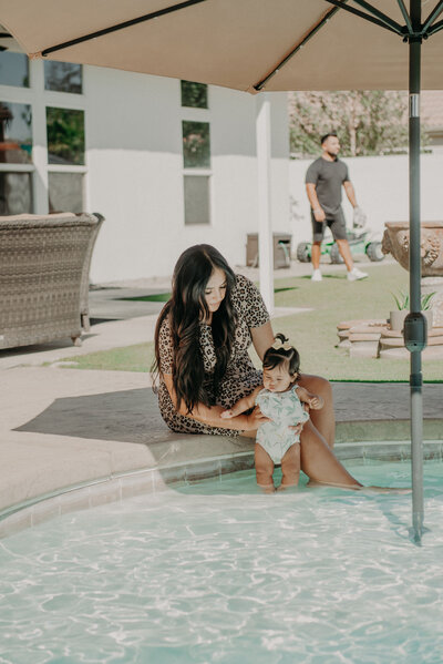 Mother and baby in new Bakersfield home pool