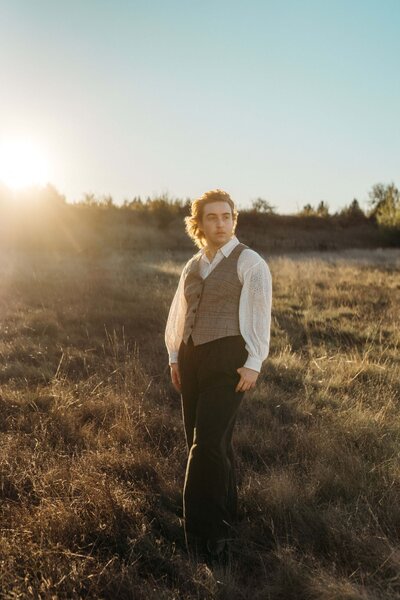 A person dancing as they walk down the aisle of a consignment store 