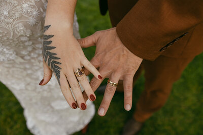 bride and groom with wedding rings