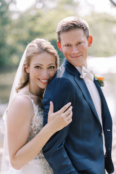 Couple smiles at camera after getting married at the Allenberry resort