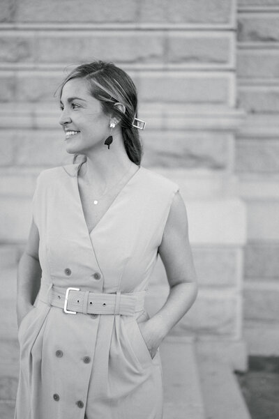 Kelsey Halm standing on a porch in Charleston South Carolina