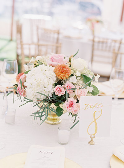 Orange and pink centerpiece for tented wedding at Chesapeake Bay Maritime Museum