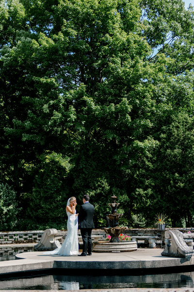 intimate first look moments between bride and groom at the Felt Mansion in Holland Michigan Wedding Photographer