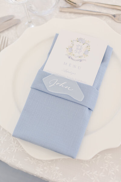 Sea glass place card with calligraphy on light blue napkin for  Greenwich, Connecticut wedding