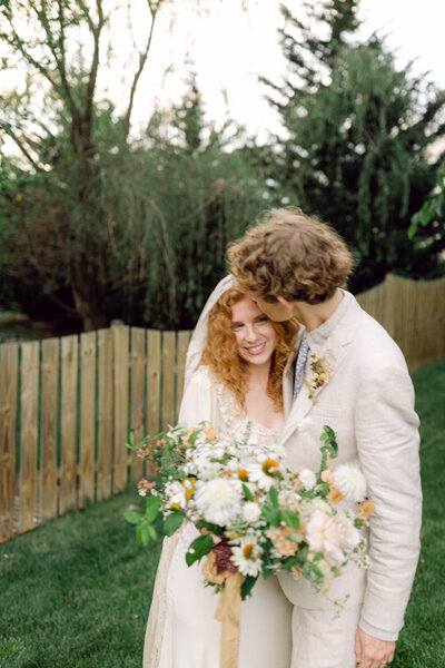 Bride Peyton Curry beams with joy during her intimate backyard wedding in Richmond, VA, captured candidly by a film-style photographer.