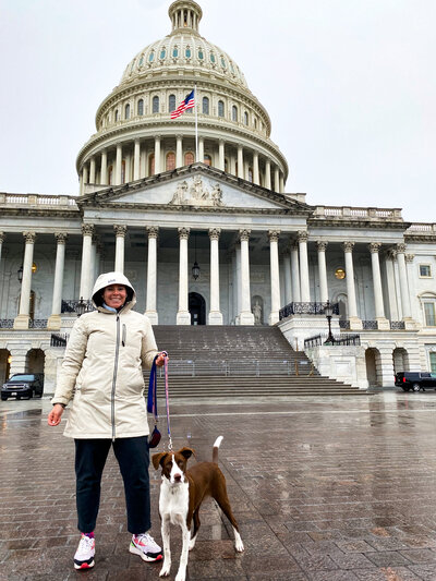 Owner of MK Mindful Media with pet dog at Capitol in Washington, DC