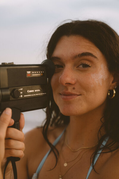 Girl holding film camera
