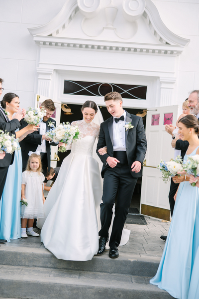 A blue and white wedding with a custom, real wedding flower bouquet.