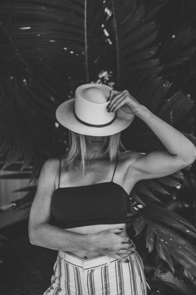 Founder and Creative Director Jordyn Snovell Posing in Front of Key West Home Black and White