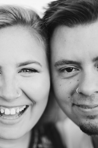close up of man and woman smiling
