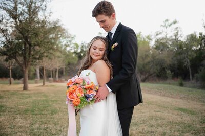 Bride and groom poses after ceremony at La Bonne Vie Ranch in the spring