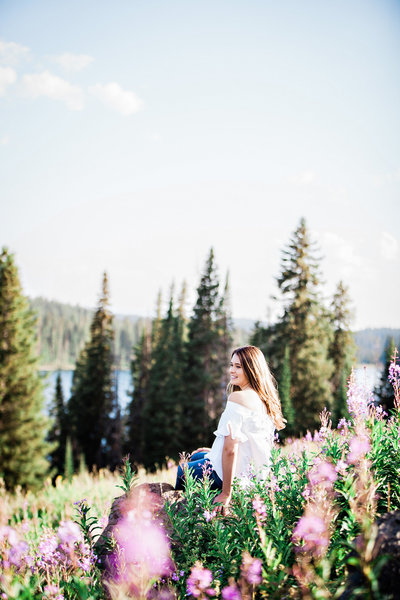 High school senior on the side of a mountain in a meadow