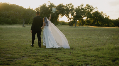 bride and groom holding hands