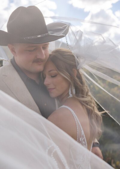 bride and groom embracing