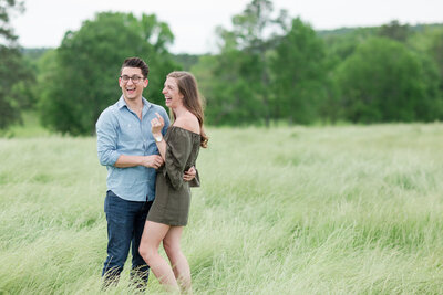 Couple Laughing in Green Field