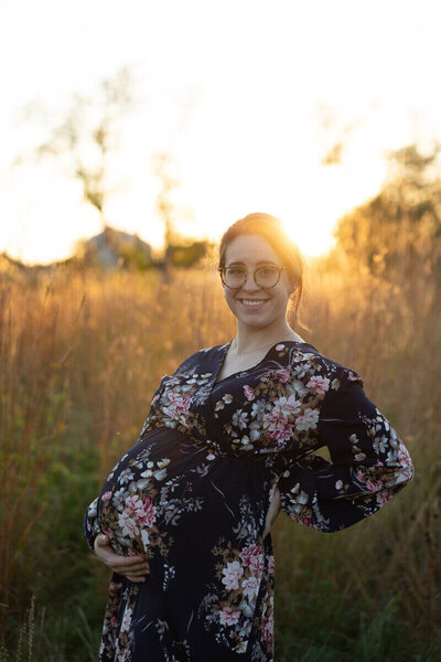 pregnant mom embracing her belly