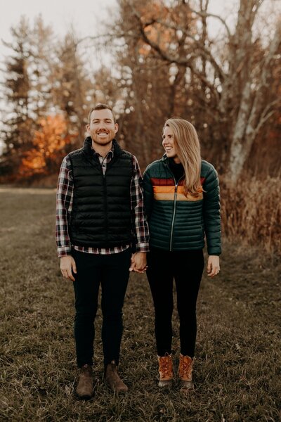 Couple holding hands and smiling