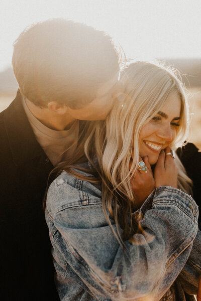 Golden hour couple embracing and smiling