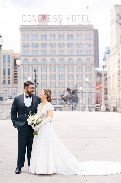 Bride and Groom in downtown Chicago with the Congress hotel in the background.