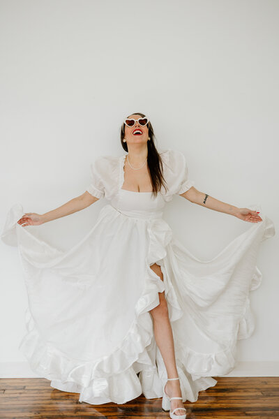 Connecticut bride twirling her dress during her studio bridal session