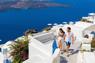 Couple walking on hills in greece during group cruise packages​