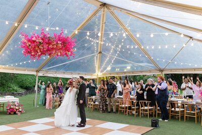 A newlywed couple dancing together at their wedding ceremony 