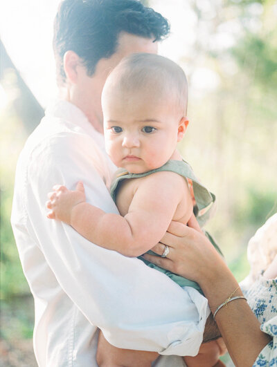 Dad holding baby boy by  Family Photographer Richmond VA Adrianne Shelton