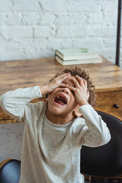 A child grappling with anxiety, illustrating the challenges kids face and the need for supportive, understanding parenting.