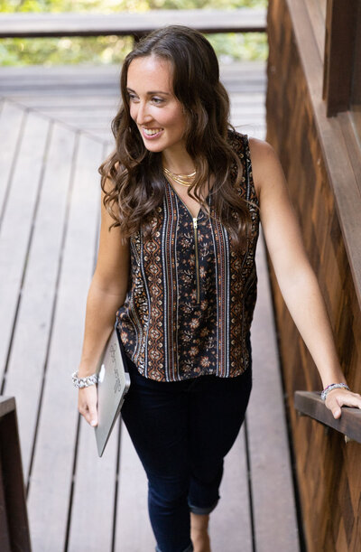 Cassandra, website designer  walking up stairs