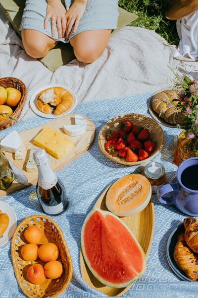 Healthy fruit and veggies on a picnic blanket