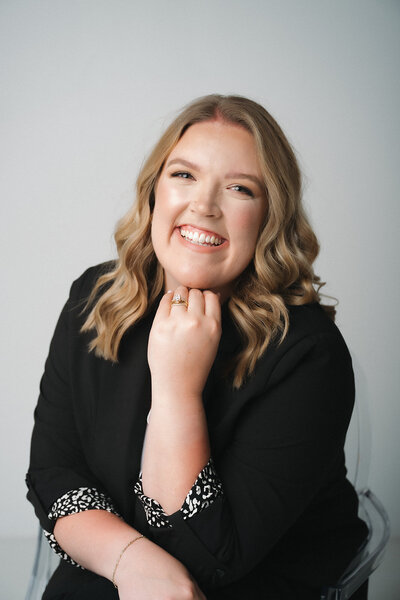 Morgan, lead wedding planner at Blush Events in Wichita, Kansas, smiling in professional portrait.