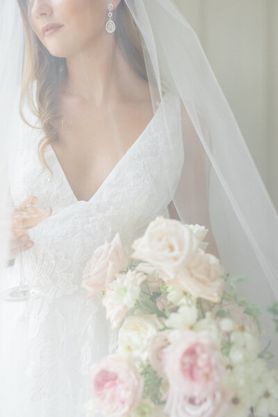 Beautiful bride in a stunning wedding gown with beautiful florals