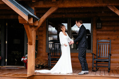Couple sharing a joyful moment on a rustic porch