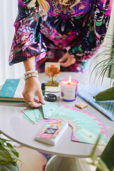 Katie, spiritual entrepreneur coach, conducting a reading, sharing her mystical insights and guidance.