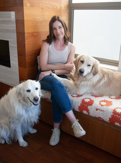 A photo of Hailey Soren and her two golden retrievers in Los Angeles California