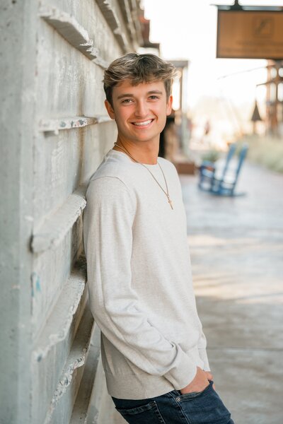 senior boy posing for photo at dc ranch market street 