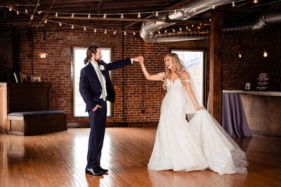 Groom twirling his fiance at their Cannery ONE Wedding