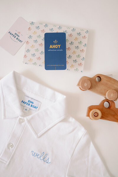 Little Paper Boat polo shirt and packaging