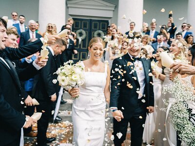 Bride and groom walk up memorial steps at their DC wedding